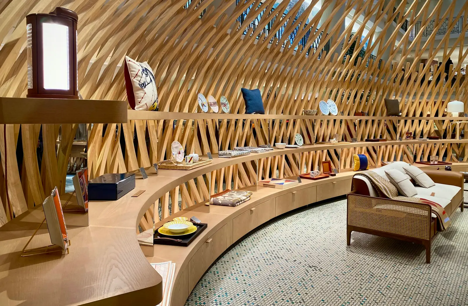 Lit boutique with curved wood shelving