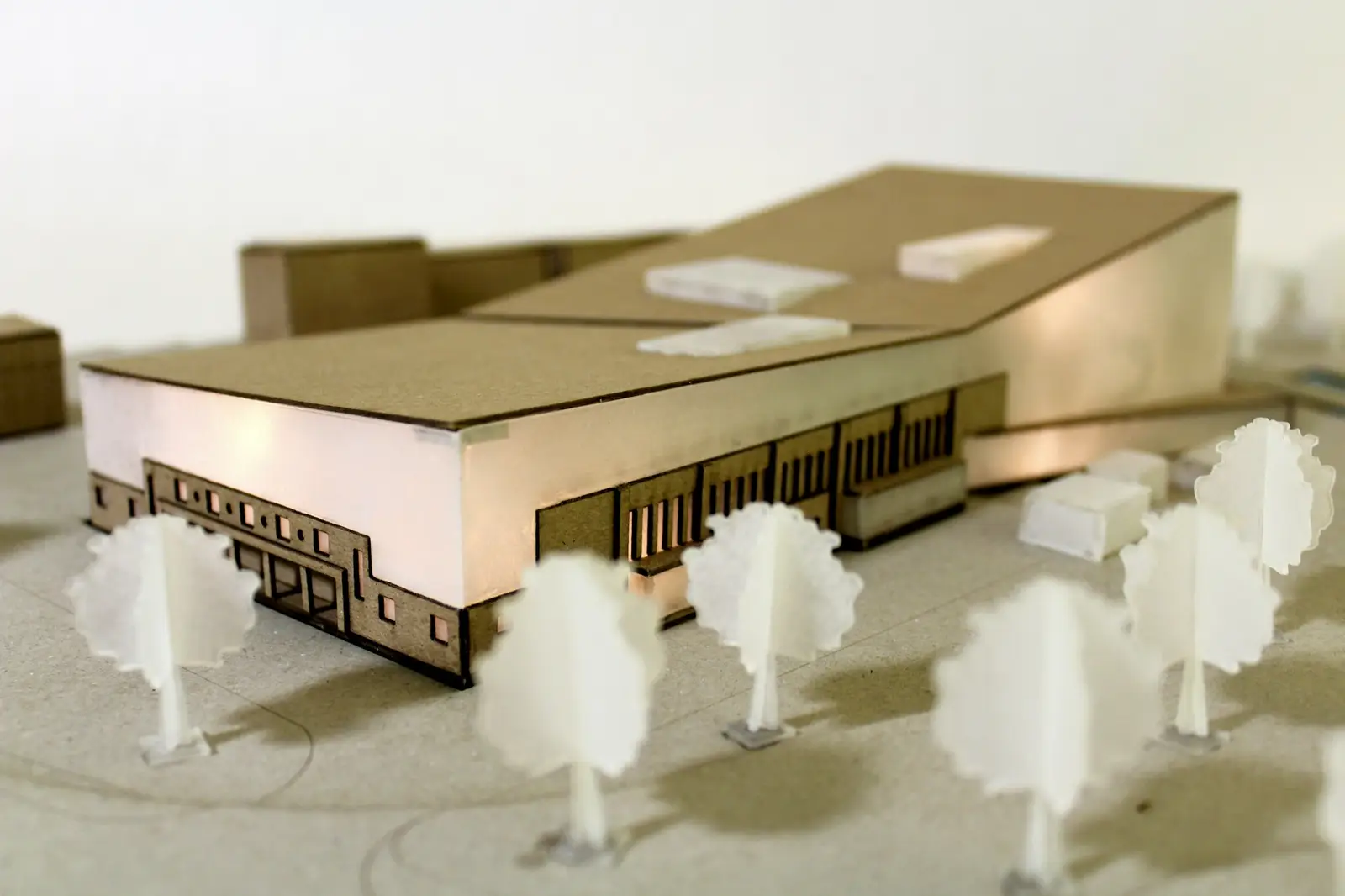 Architectural model with tree figures on a white base