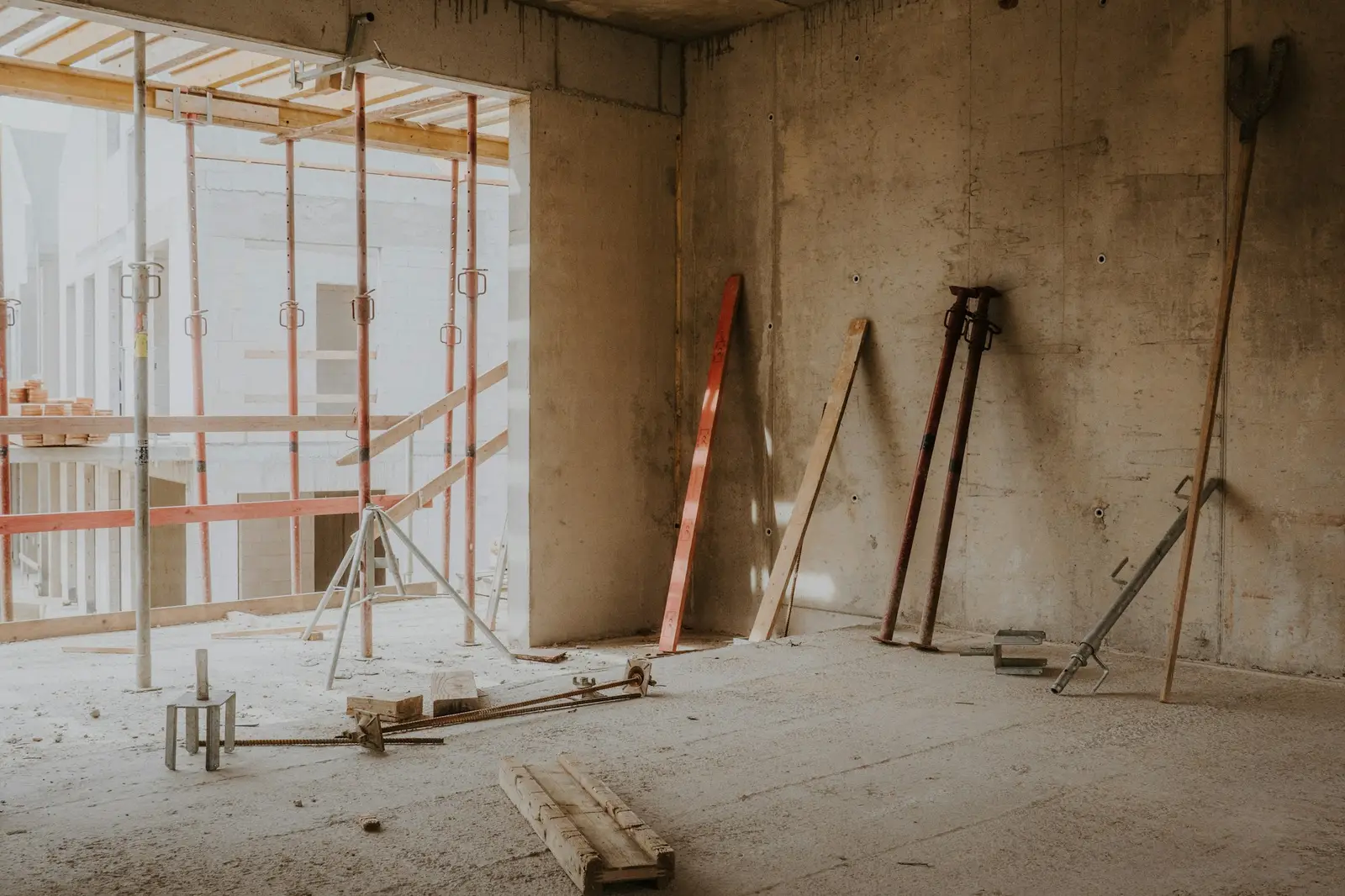 Interior under construction with scaffolding and wood shoring